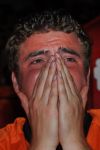 A fan of the Dutch soccer team reacts at the end of the World Cup soccer final match between Netherlands and Spain in Amsterdam, Netherlands