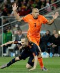 Spain’s Andres Iniesta, left, is fouled by Netherlands’ John Heitinga, right, during the World Cup final soccer match between the Netherlands and Spain at Soccer City in Johannesburg, South Africa